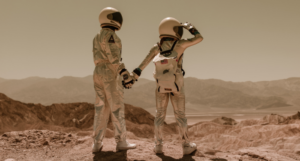 a photo of two people wearing spacesuits holding hands on a sandy planet