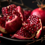 a photo of pomegranates against a dark background